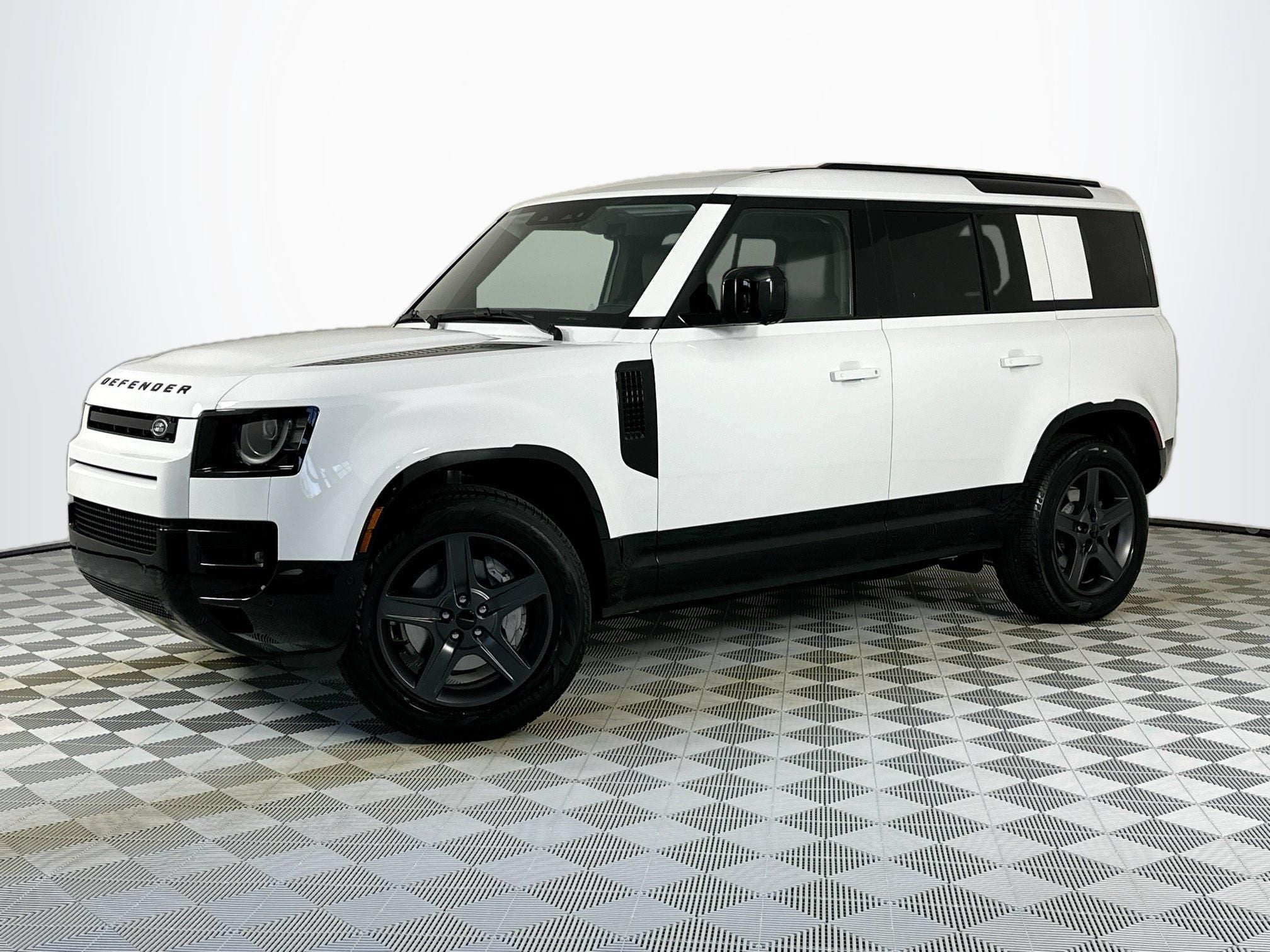2026 Land Rover Defender 110 X-Dynamic SE in Fuji White — front three-quarter view