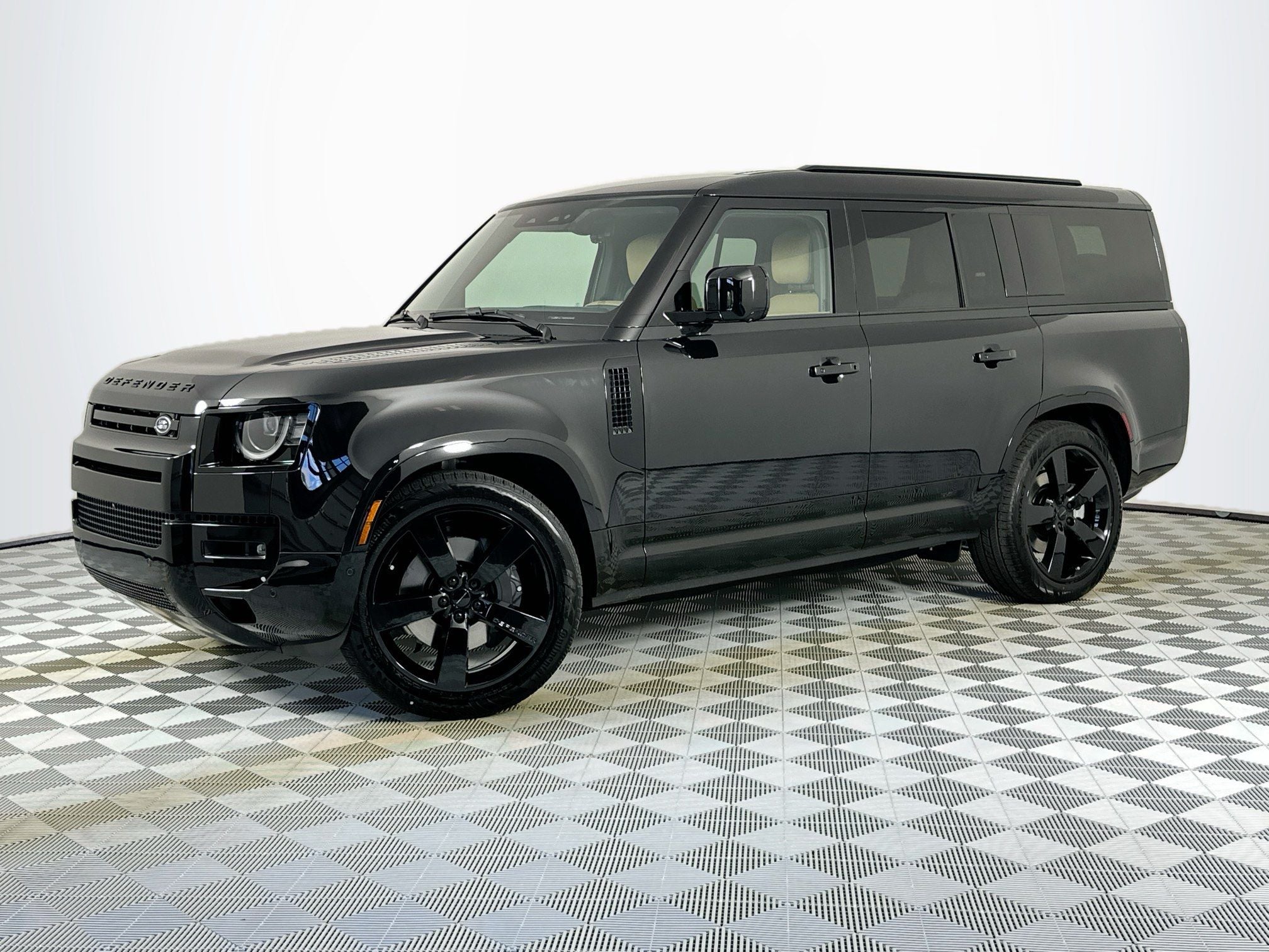 2026 Land Rover Defender 130 X-Dynamic SE in Santorini Black — front three-quarter view