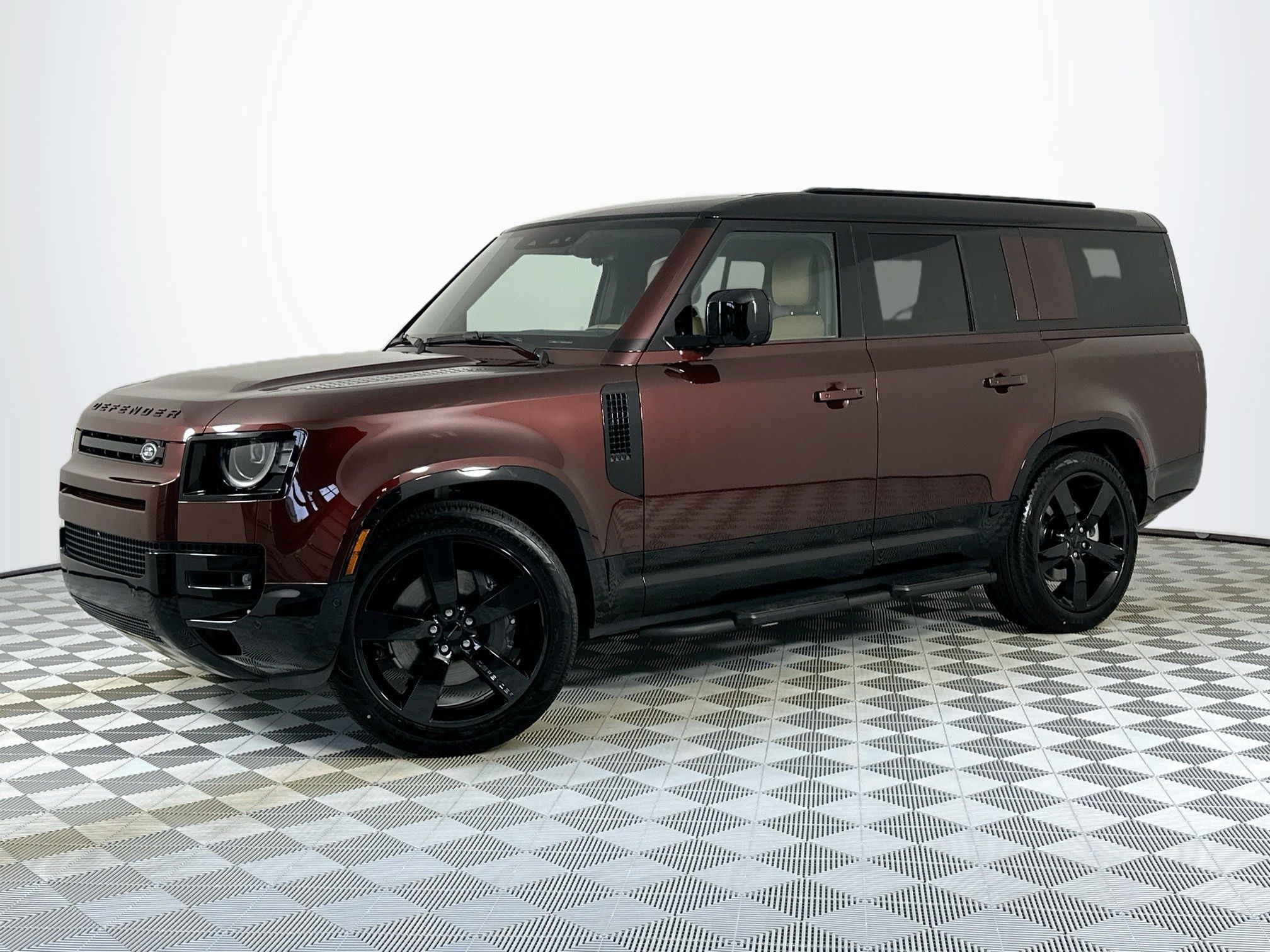 2026 Land Rover Defender 130 X-Dynamic SE in Sedona Red — front three-quarter view