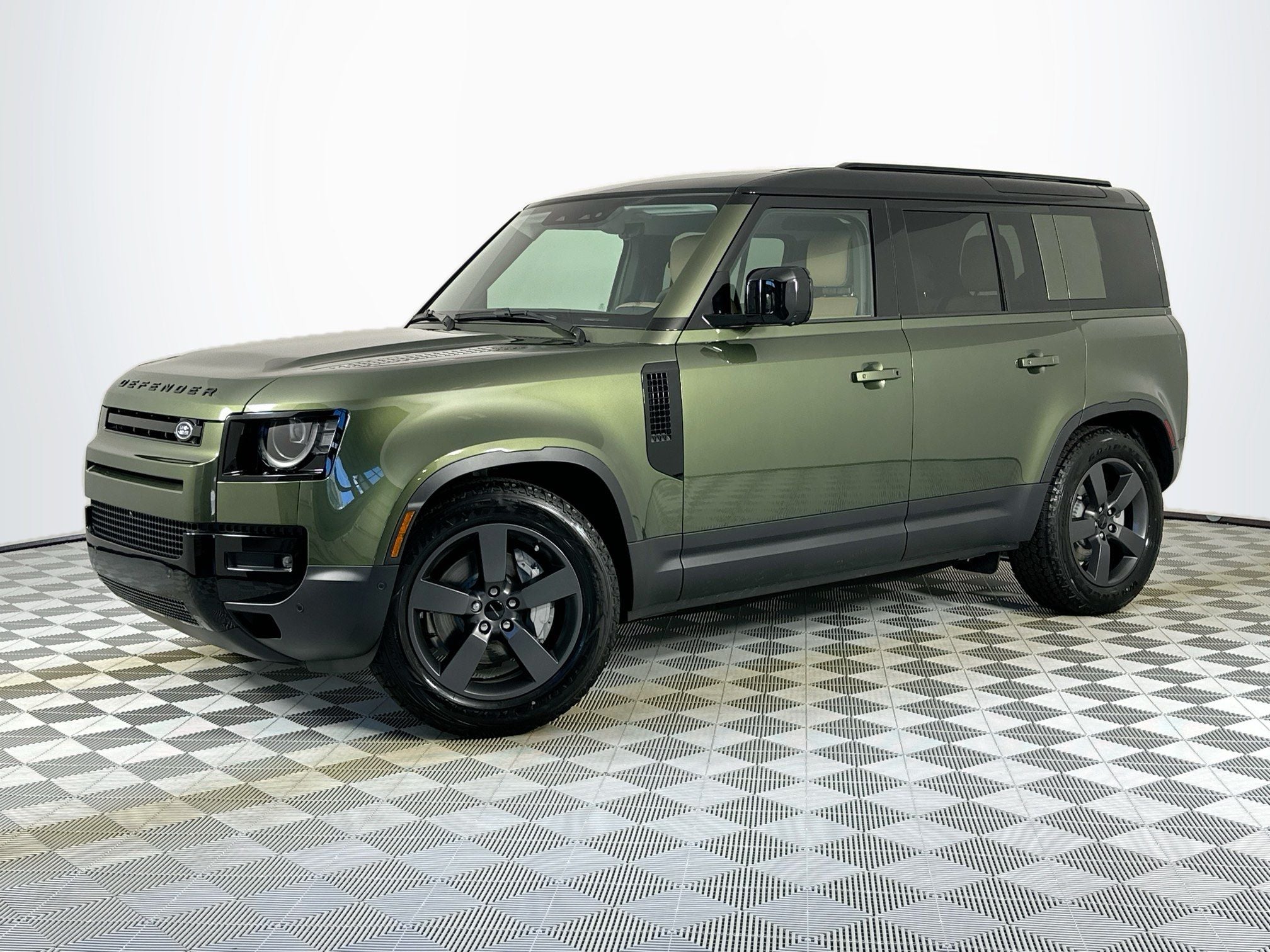2026 Land Rover Defender 110 S in Woolstone Green Metallic — front three-quarter view