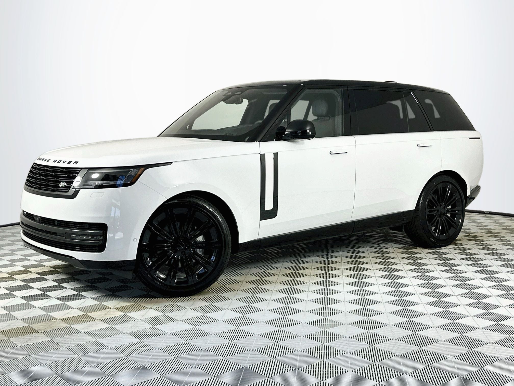 2026 Land Rover Range Rover SE LWB in Fuji White — front three-quarter view