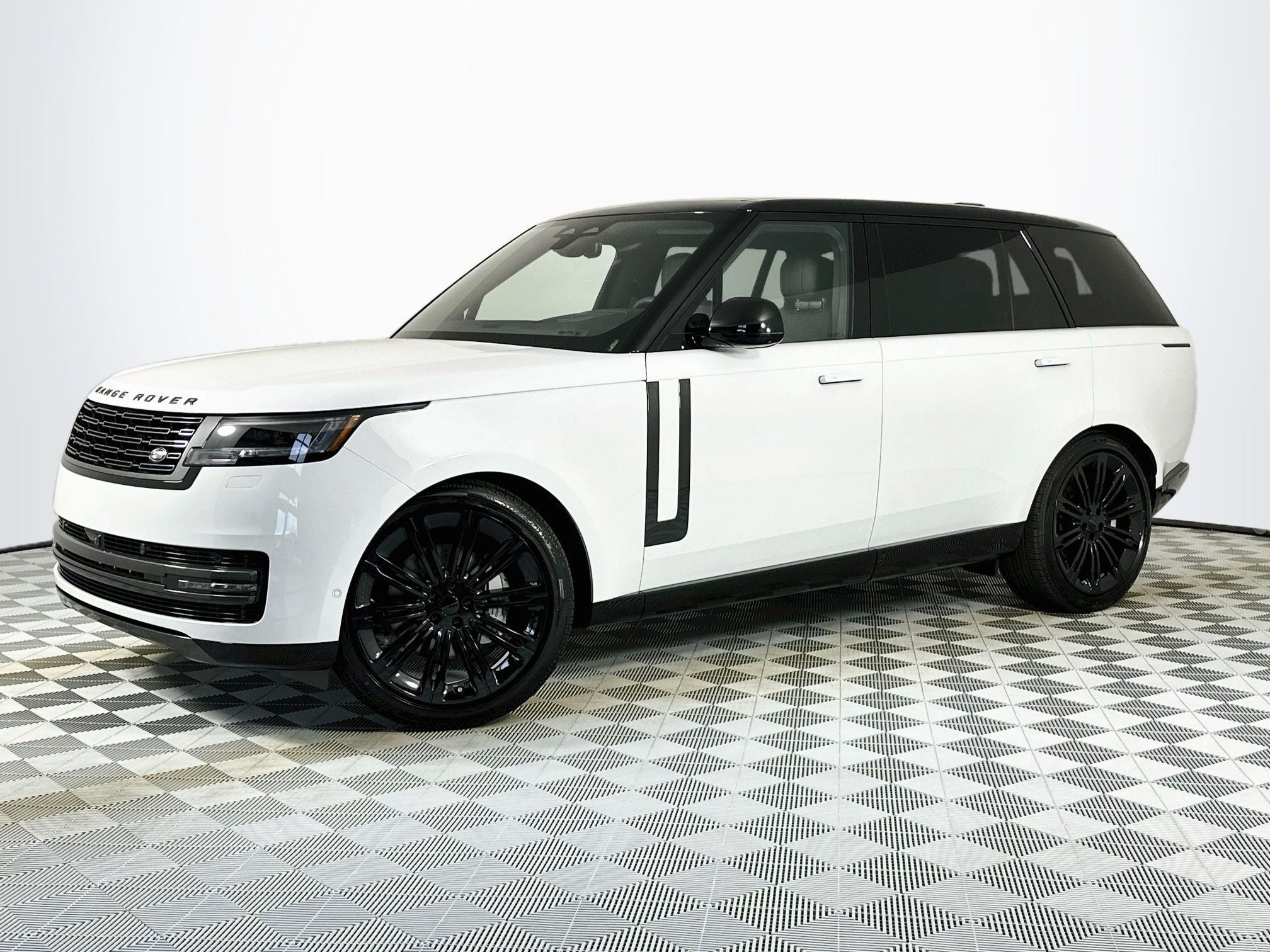 2026 Land Rover Range Rover SE LWB in Fuji White — front three-quarter view
