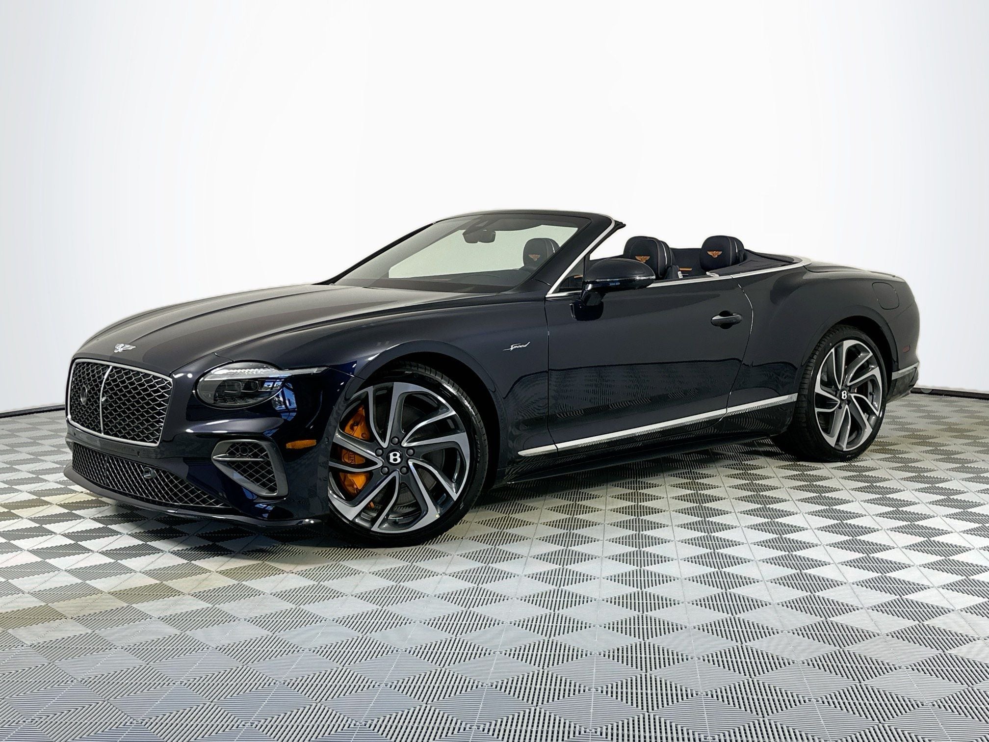 2026 Bentley Continental GTC Speed in Dark Sapphire — front three-quarter view