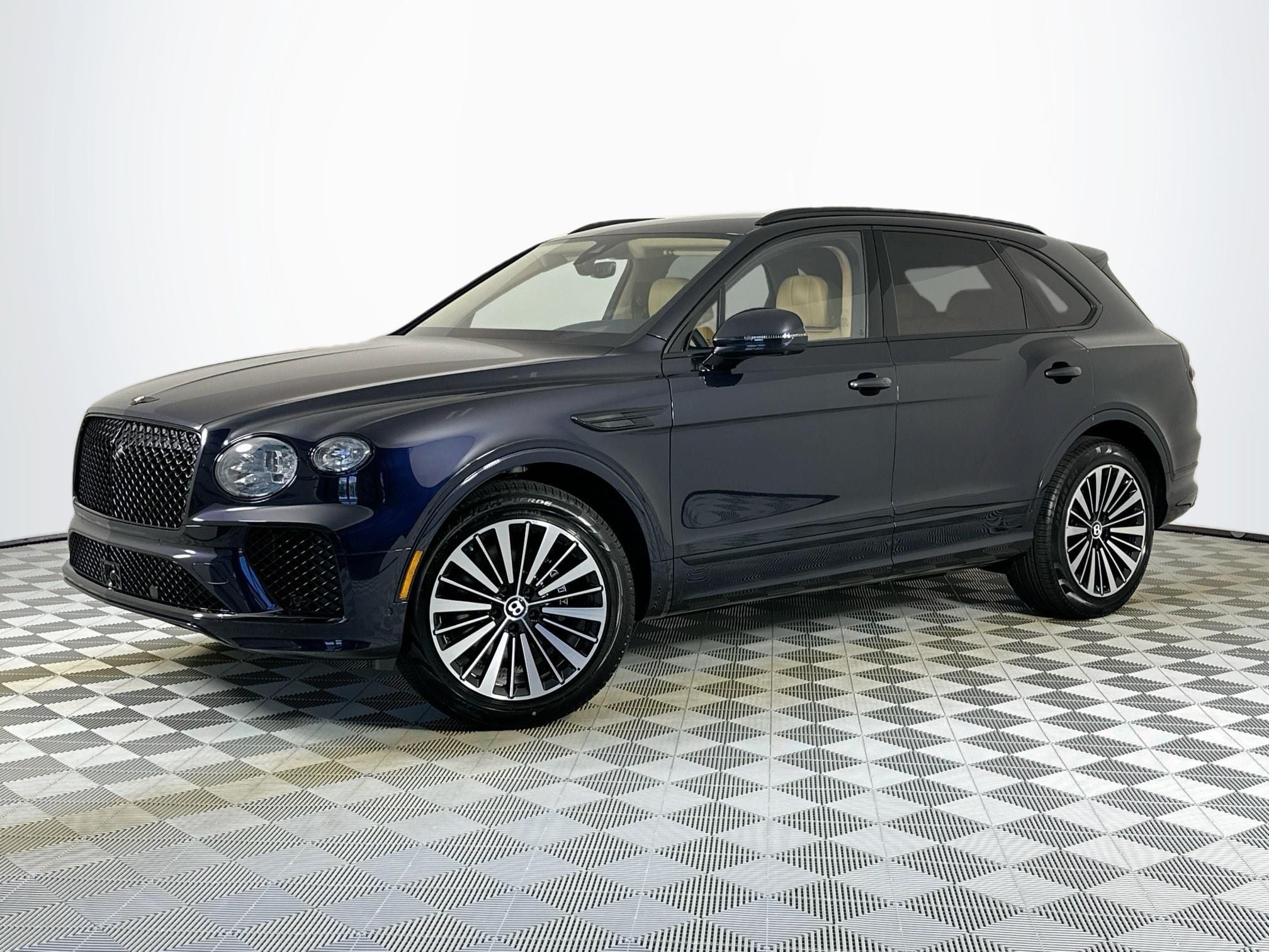 2026 Bentley Bentayga V8 in Dark Sapphire — front three-quarter view