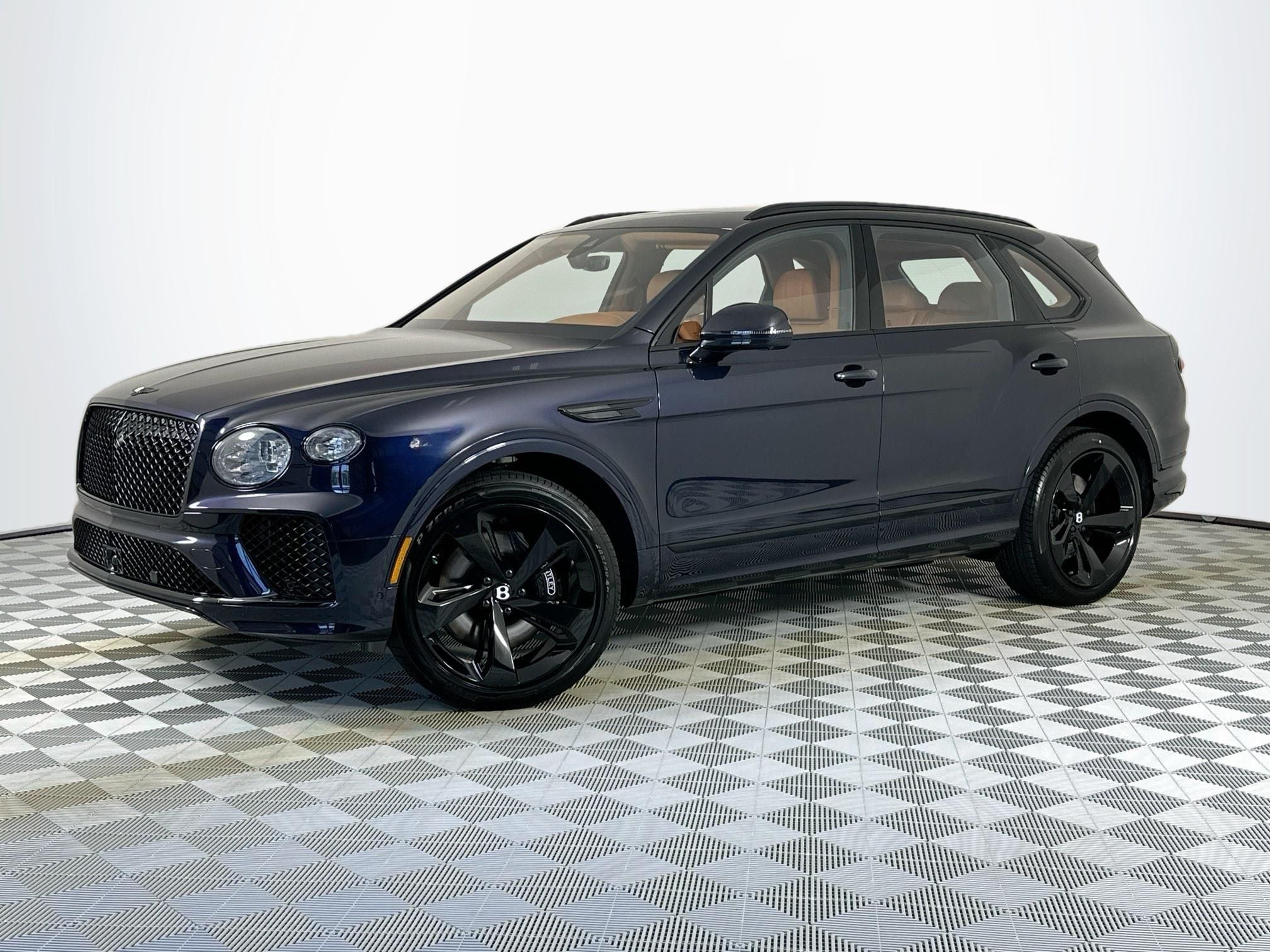2026 Bentley Bentayga V8 in Dark Sapphire — front three-quarter view